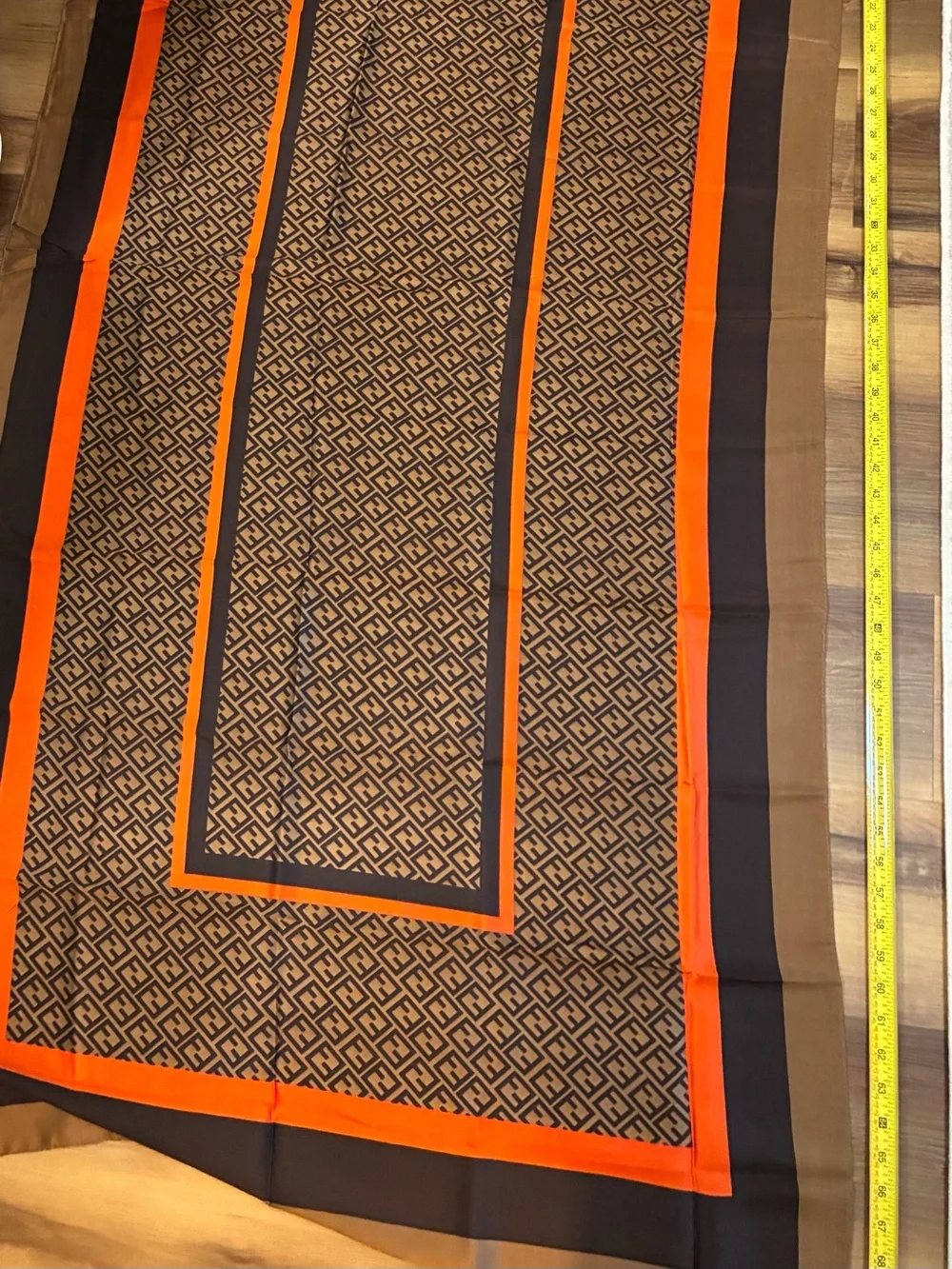 NWT brown and orange & tan geometric scarf. Polyester w/Silk feel. Approx 70 in
